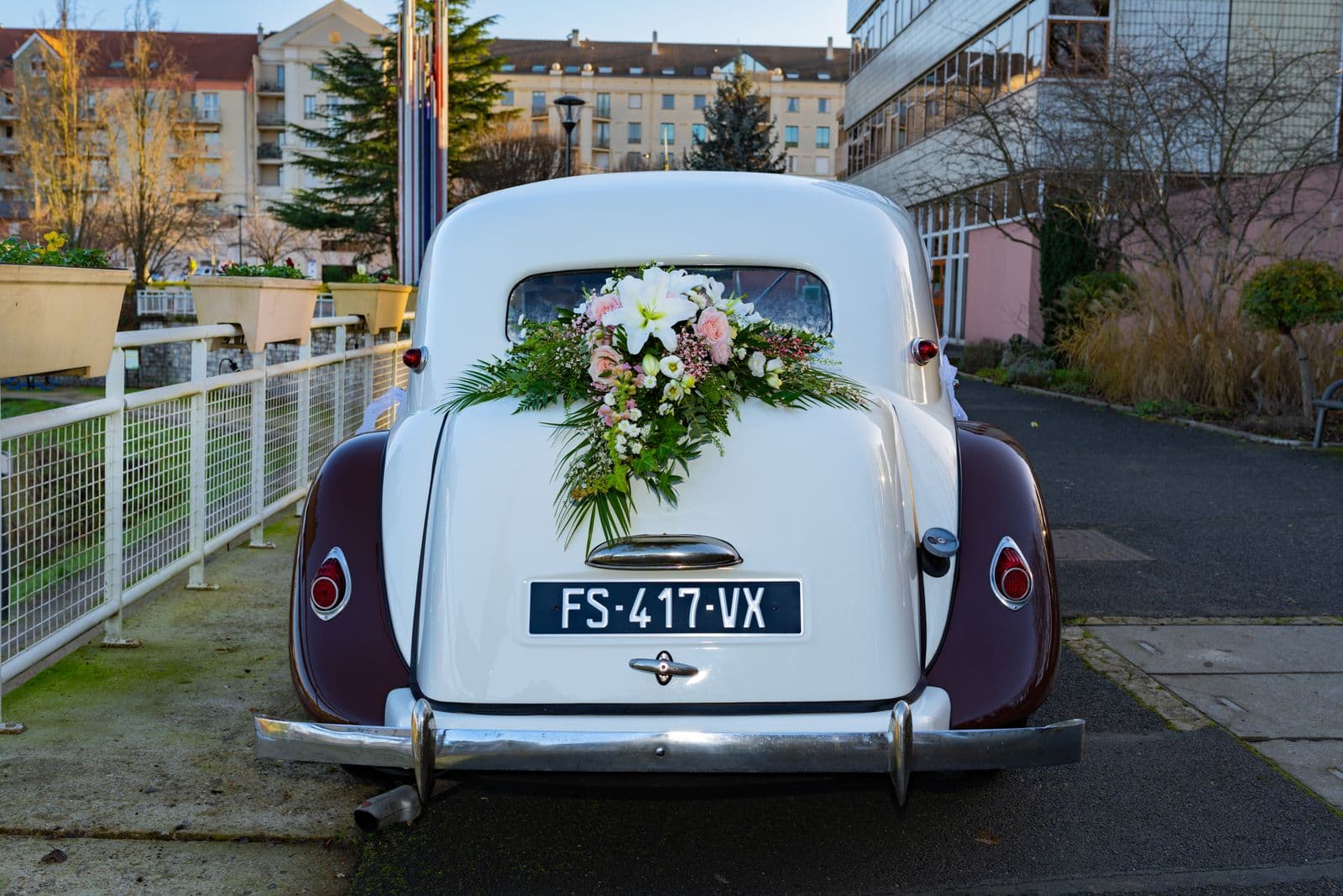 Classic vintage wedding car decorated with a floral arrangement